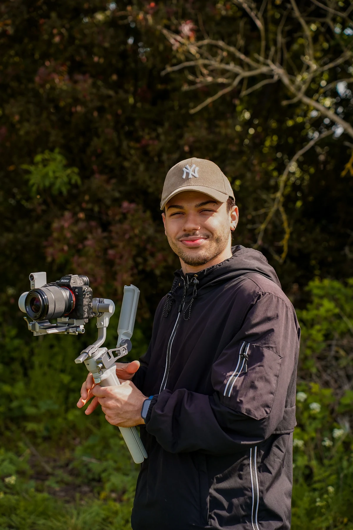 Cesar Silva holding a Sony camera mounted on a gimbal