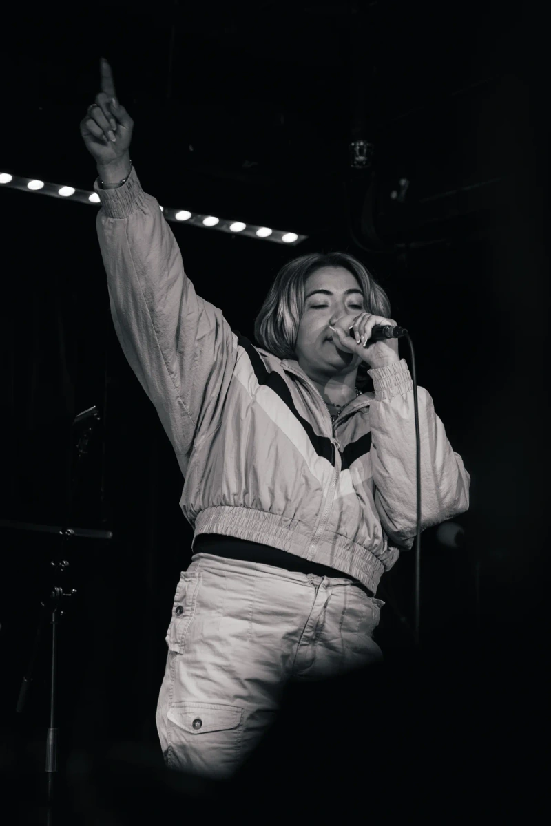 Singer celebrating a live performance on stage