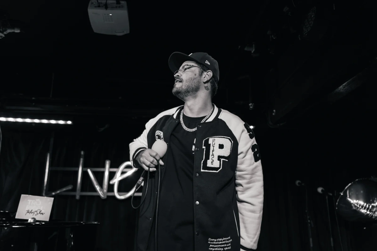 Male performer photographed between songs