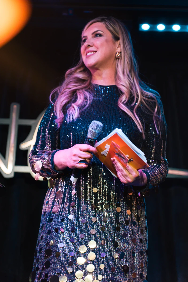 Presenter photographed on the Tropical Talent Show stage