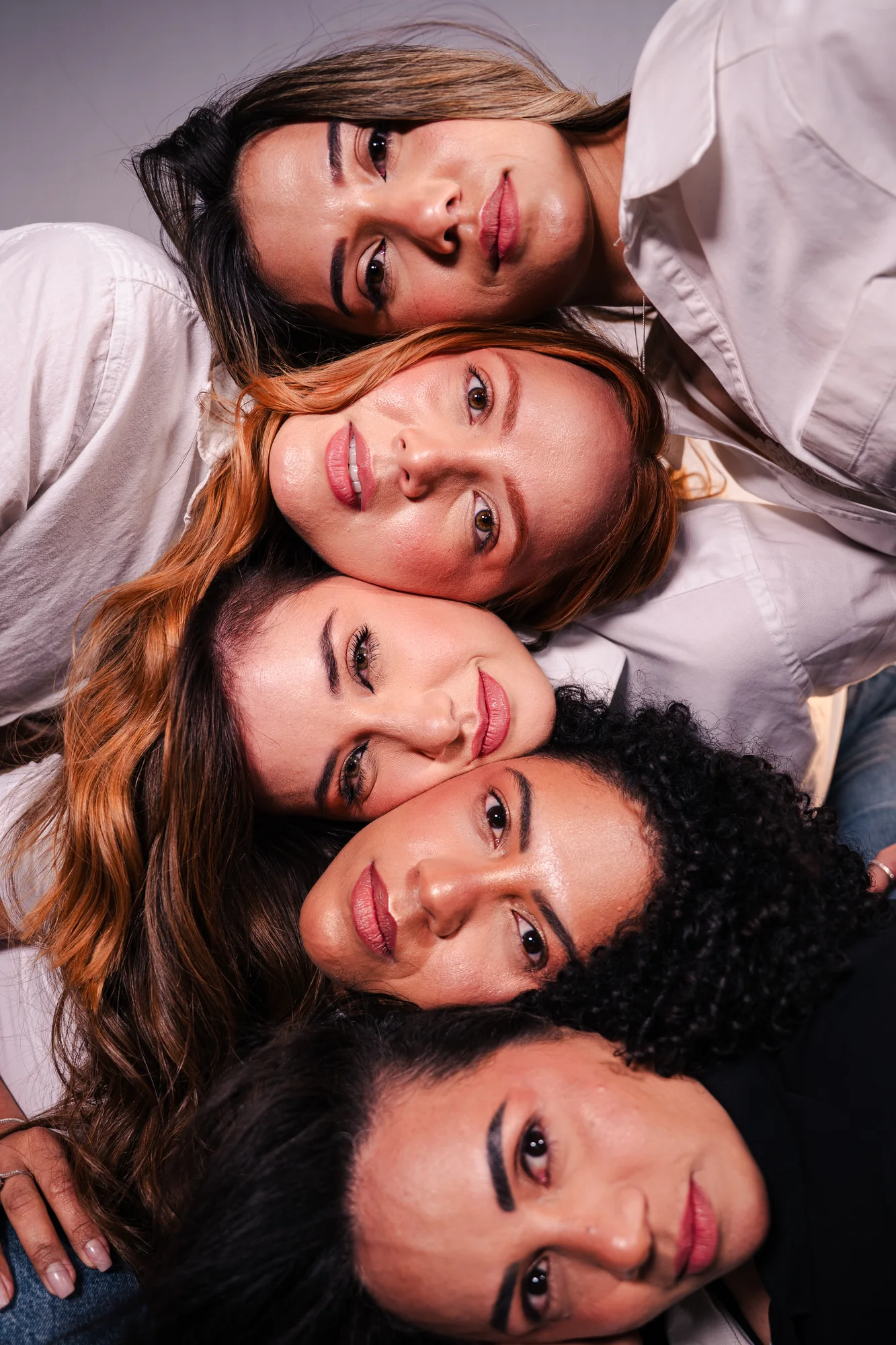 Three models photographed together for the campaign
