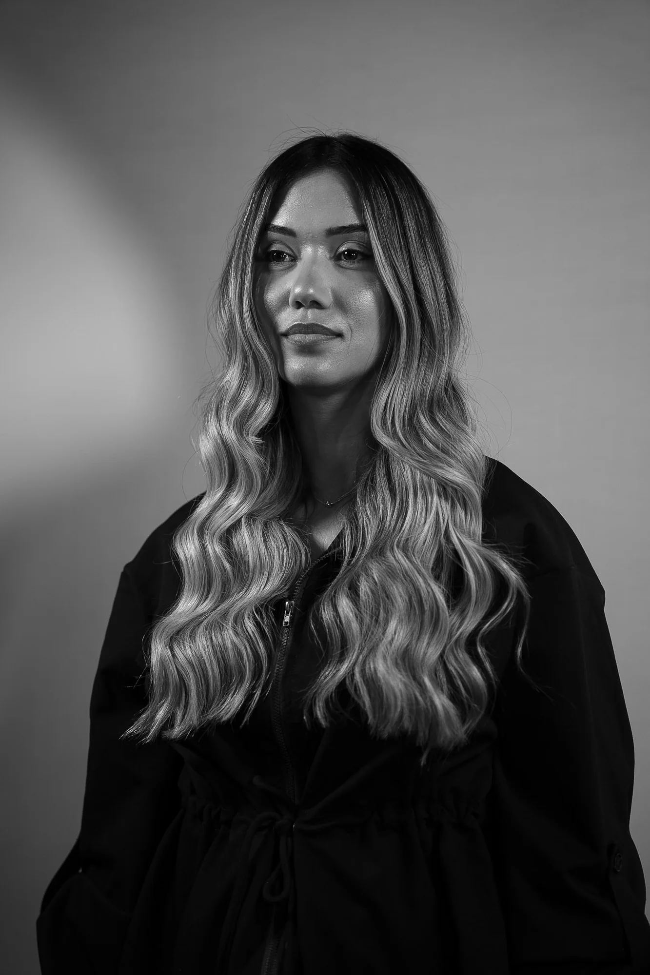 Black-and-white beauty portrait with styled blonde hair