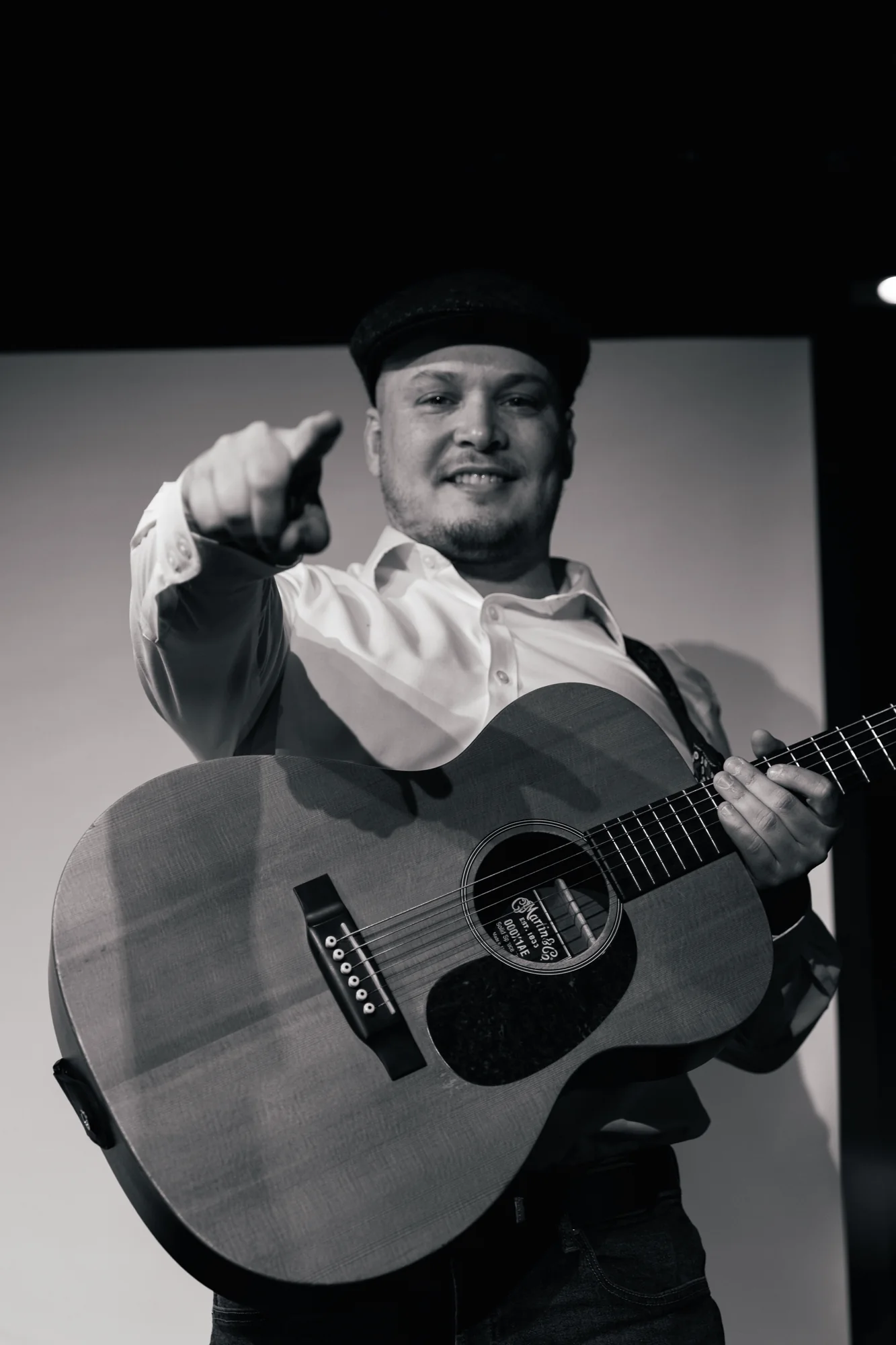 Guitarist engaging with the audience during a live performance