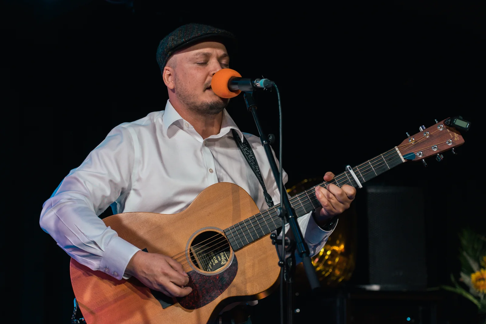 Guitarist and vocalist performing at the Tropical Talent Show