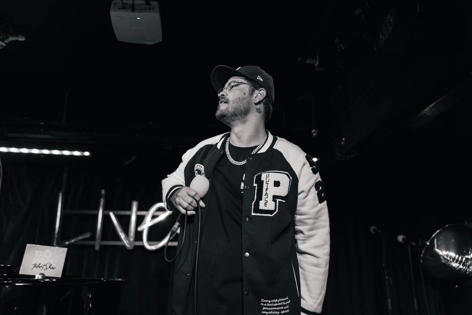 Male performer photographed between songs