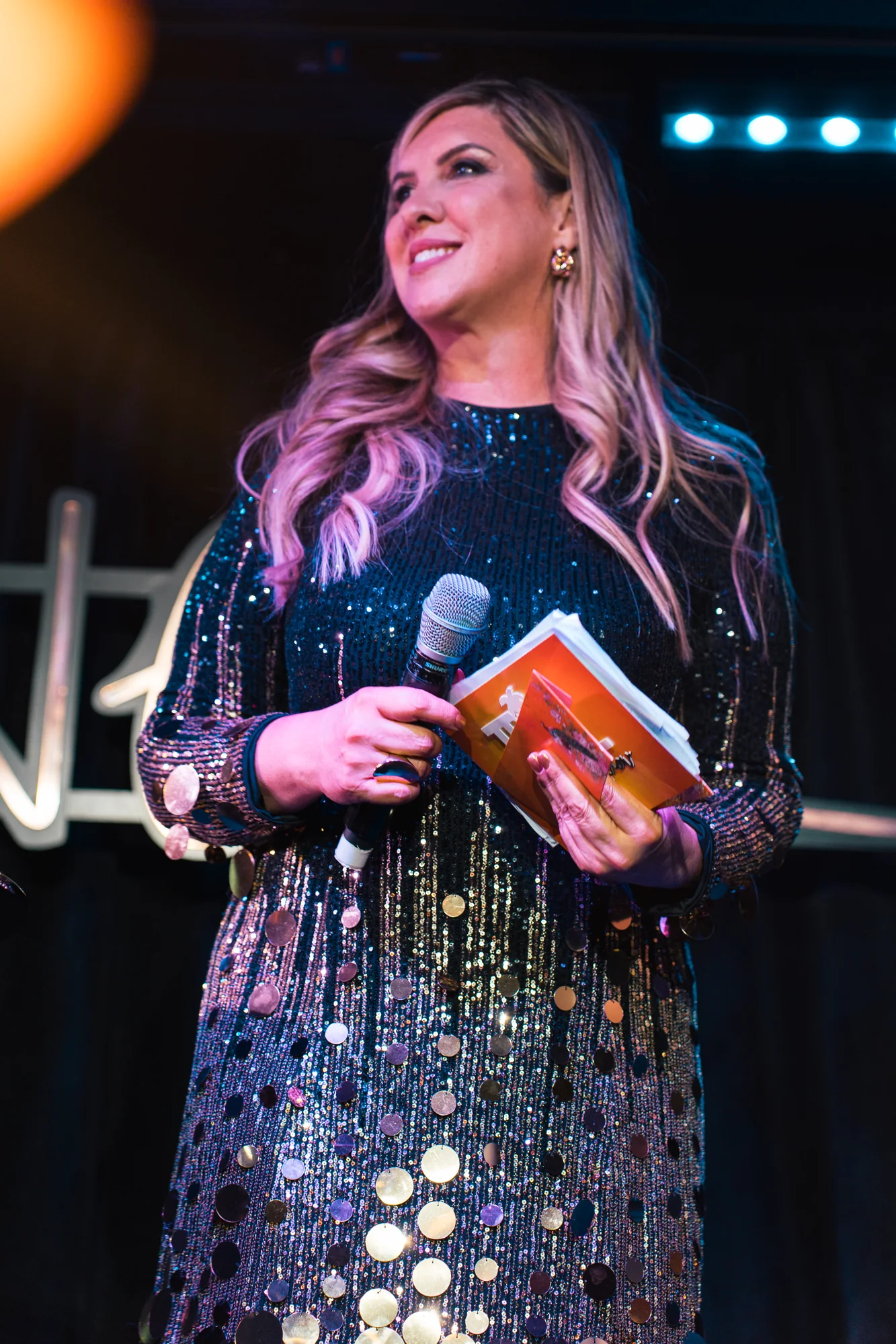 Presenter photographed on the Tropical Talent Show stage
